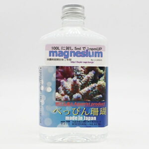 White bottle of magnesium supplement for reef aquariums, with a coral photo on the label; made in Japan.