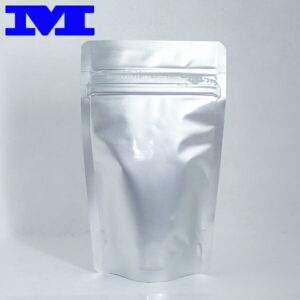 Silver stand-up resealable pouch with a zip-top closure; blue 'M' logo in the top-left corner.